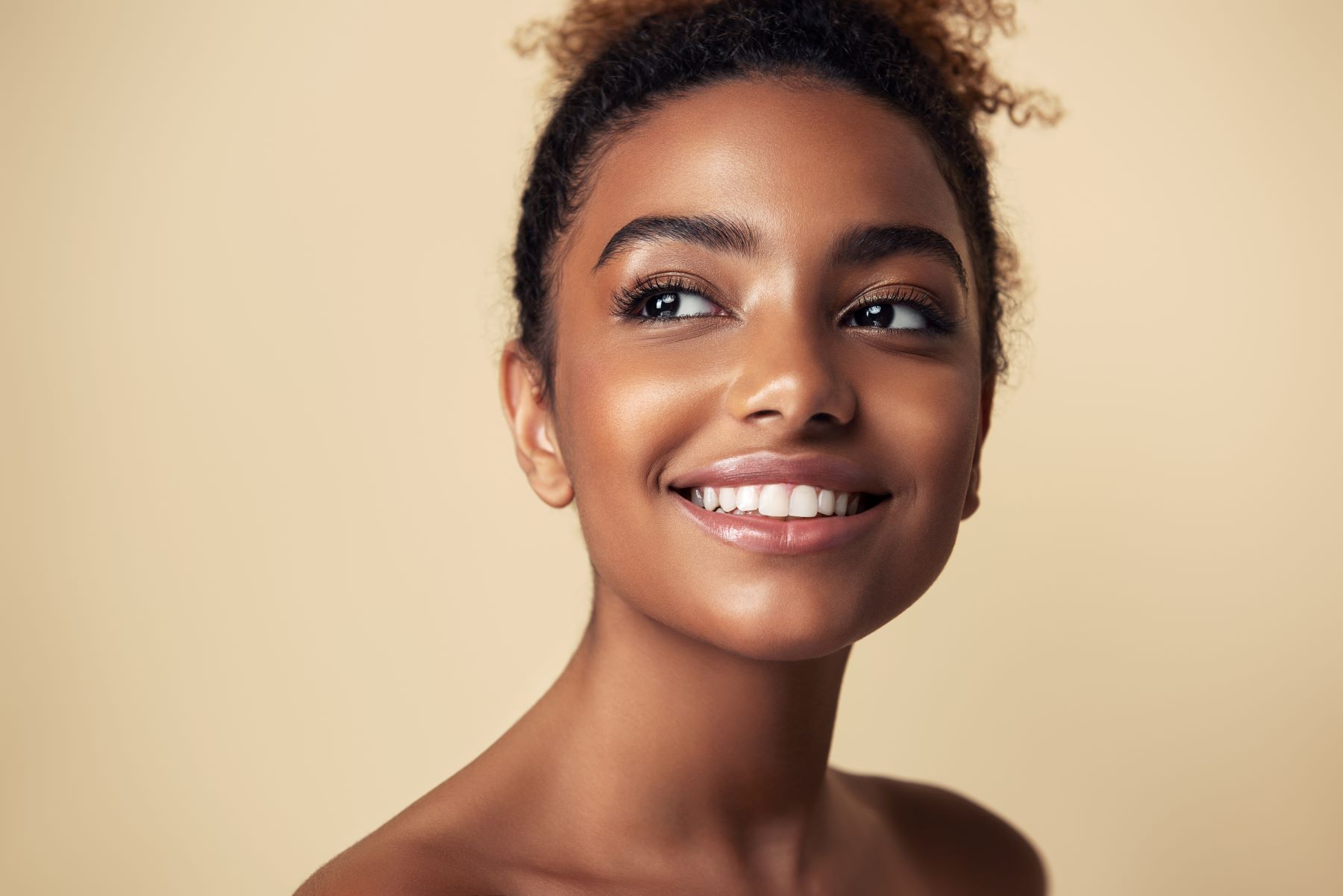 Woman in Washington DC smiling after her AccuTite appointment at Cultura.